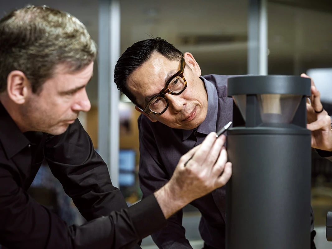 A WE-EF lighting specialist discusses a custom outdoor lighting solution with a customer.