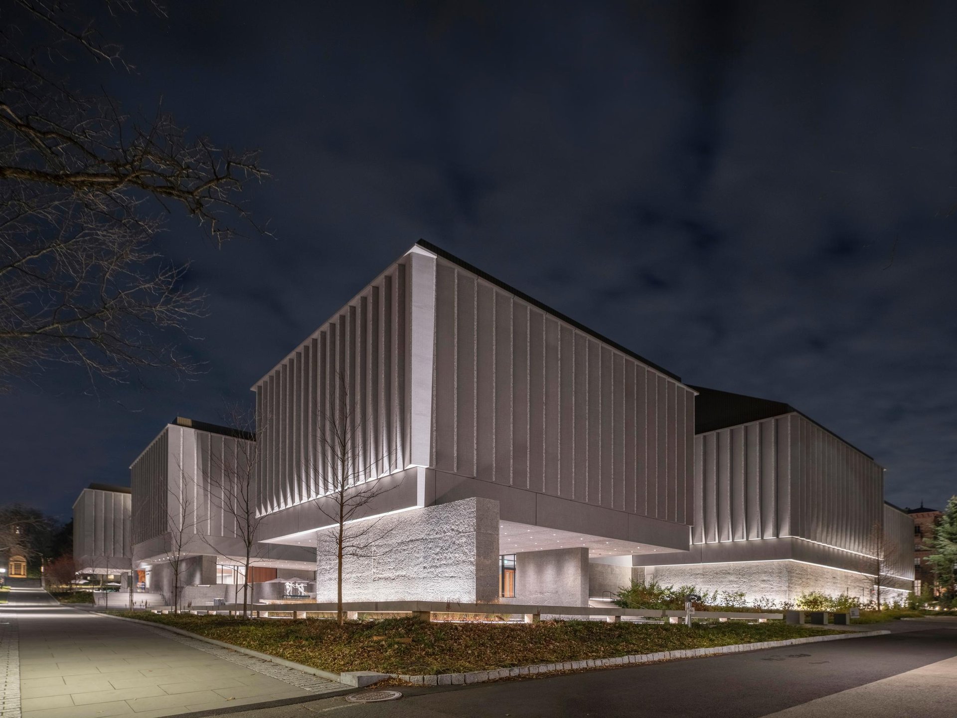 Exterior facade of the museum. The lower part of the walls are lit with wallwash lighting.
